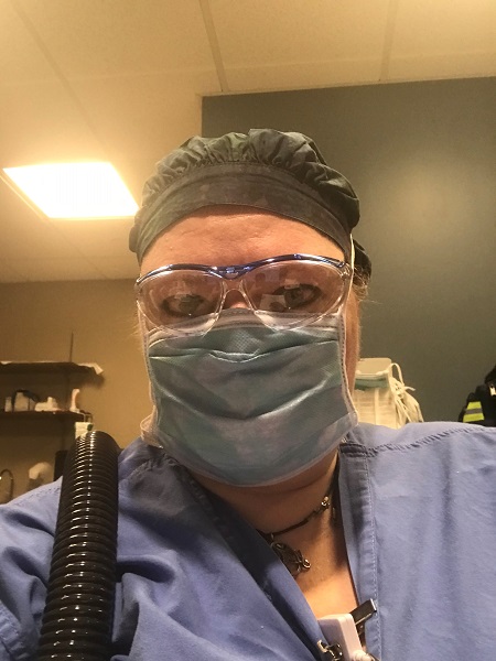 Elizabeth Tomaszewski, DNP, track director of the Adult-Gerontology Acute Care Nurse Practitioner Program (AGACNP) and assistant clinical professor, wearing PPE during her shift